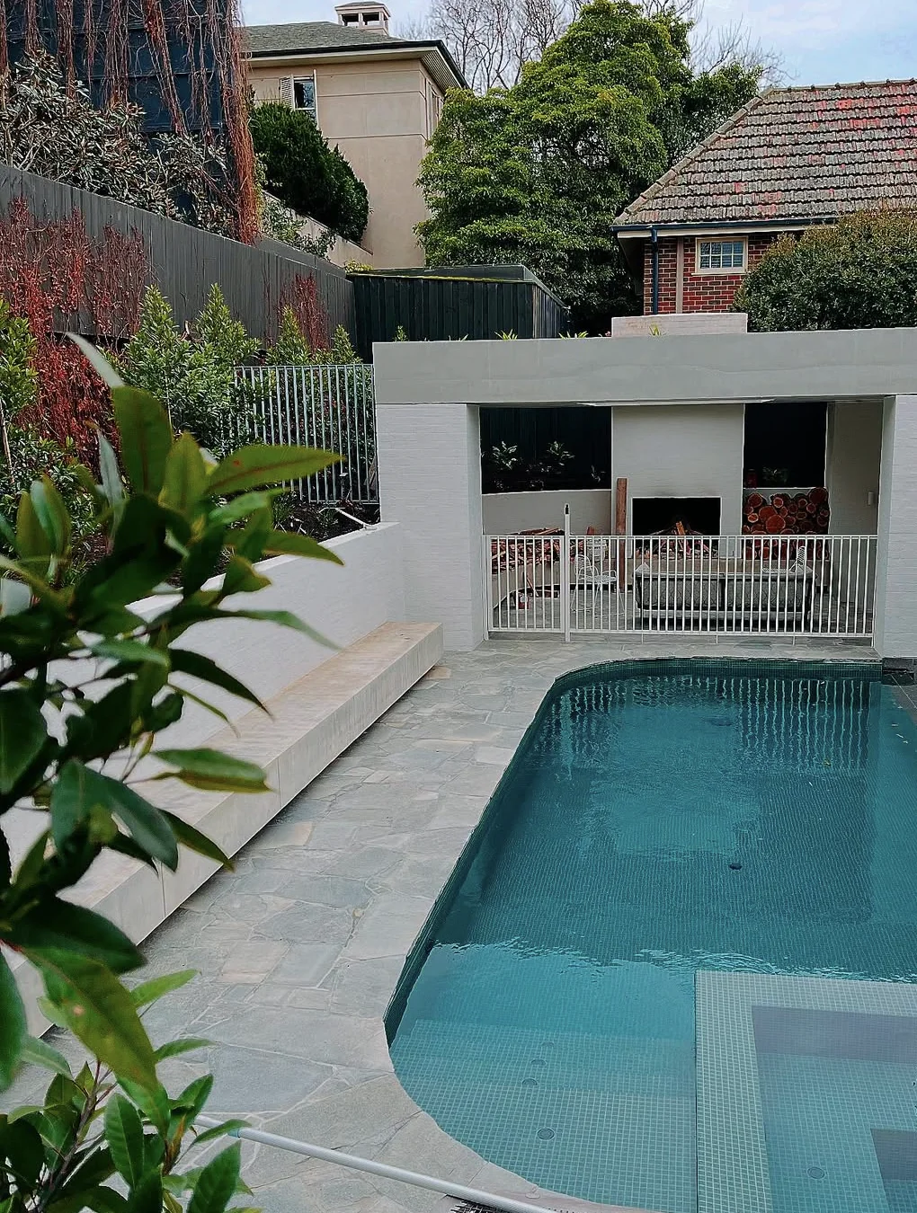 Bluestone paving and garden planting around a Malvern pool