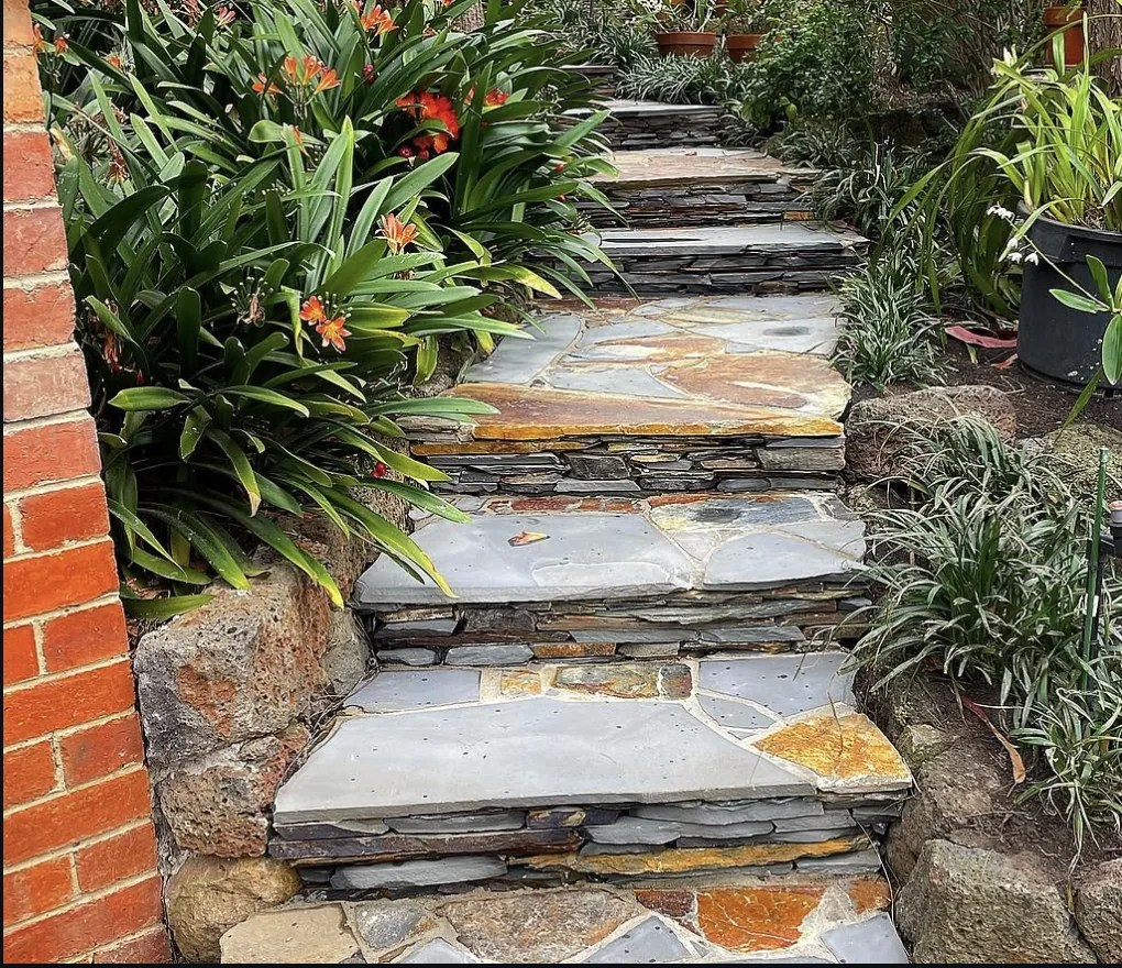 Hand-laid natural stone garden steps surrounded by greenery in Ivanhoe