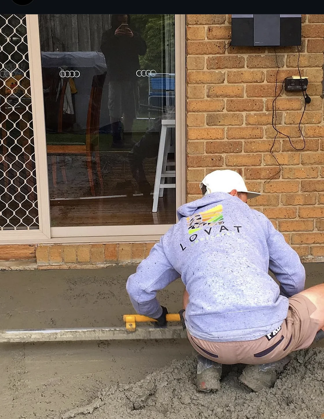 Lovat landscaper carefully levelling the base for natural stone paving